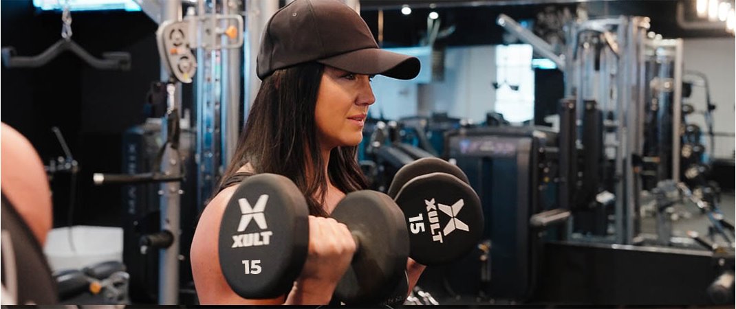 Woman strength training with dumbbells